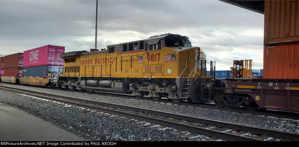 UP 9817 Heads Eastbound as A Mid-DPU On A Stack Train 